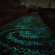 Illustration for article titled The World's First Glow-in-the-Dark Bike Path Glimmers a Ghostly Green